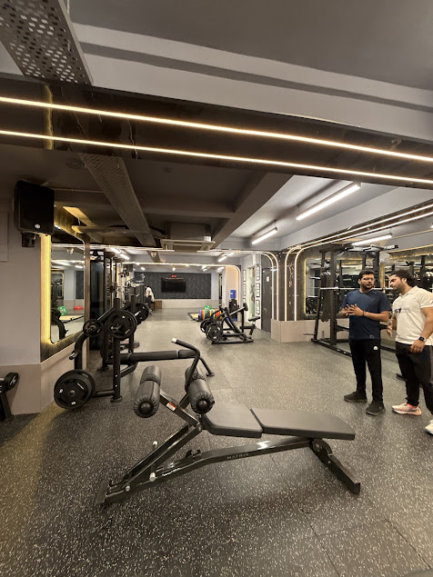 Professional weight training space with cable machines and dumbbells
